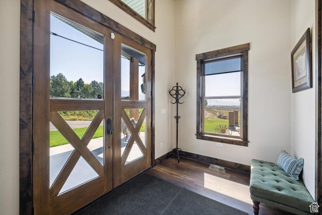6117 Rocky Ridge Rd N, Peoa, UT 84061 - entrance foyer with dark wood-type flooring, a wealth of natural light, and french doors