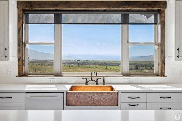 6117 Rocky Ridge Rd N, Peoa, UT 84061 - kitchen with sink, dishwasher, white cabinets, a mountain view, and decorative backsplash