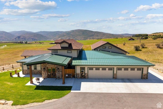 6117 Rocky Ridge Rd N, Peoa, UT 84061 - view of front facade with a mountain view, a garage, and a front yard