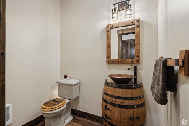 6117 Rocky Ridge Rd N, Peoa, UT 84061 - bathroom featuring sink, hardwood / wood-style flooring, and toilet
