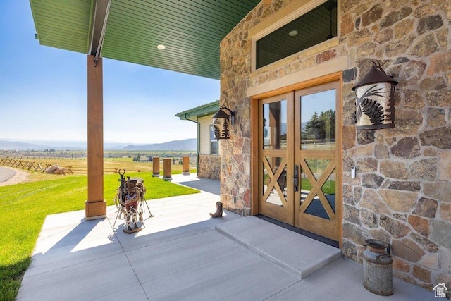 6117 Rocky Ridge Rd N, Peoa, UT 84061 - property entrance featuring a rural view, a mountain view, a yard, and french doors