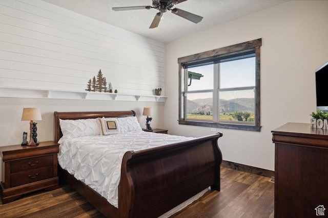 6117 Rocky Ridge Rd N, Peoa, UT 84061 - bedroom with ceiling fan, dark hardwood / wood-style flooring, and a textured ceiling