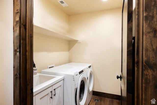 6117 Rocky Ridge Rd N, Peoa, UT 84061 - laundry room with sink, dark hardwood / wood-style floors, washer and clothes dryer, and cabinets