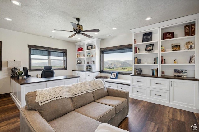 6117 Rocky Ridge Rd N, Peoa, UT 84061 - living room featuring ceiling fan, dark hardwood / wood-style floors, and a textured ceiling