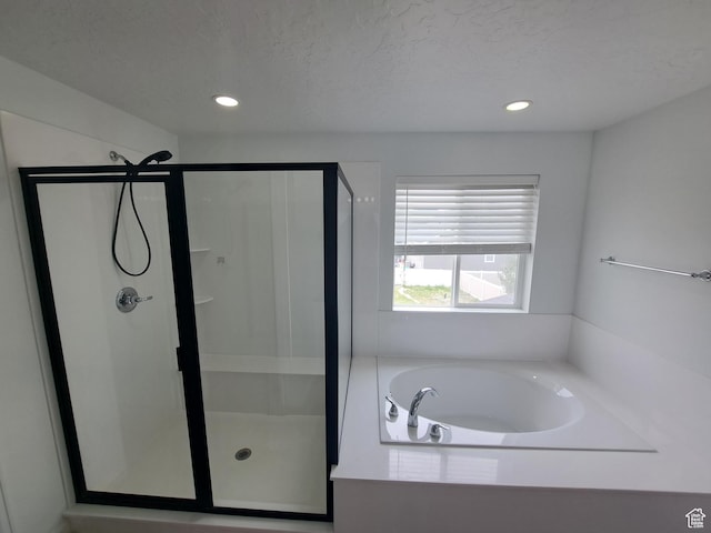128 Tram Rock Rd, Lake Point, UT 84074 - bathroom with a stall shower, a bath, and recessed lighting