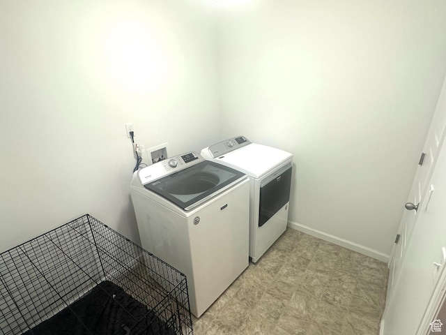 laundry area with separate washer and dryer