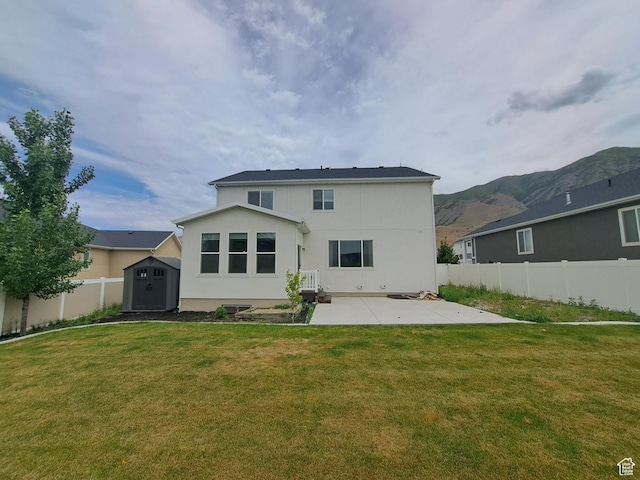 128 Tram Rock Rd, Lake Point, UT 84074 - rear view of house with a patio, stucco siding, and a mountain view