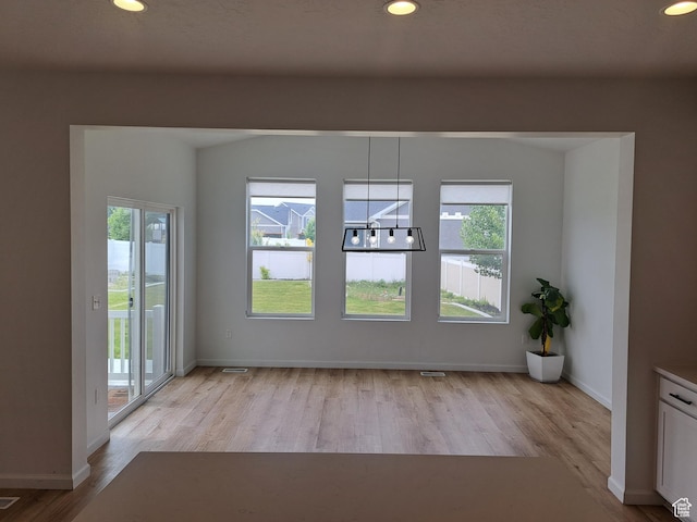 128 Tram Rock Rd, Lake Point, UT 84074 - spare room featuring wood finished floors, recessed lighting, baseboards, and a chandelier