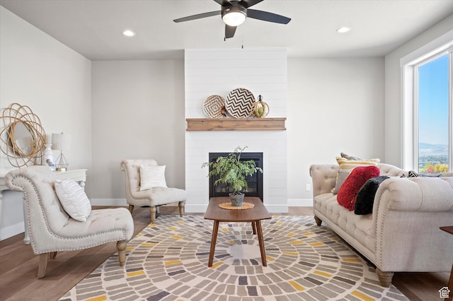 831 E 490 N Unit 143, Hyde Park, UT 84318 - living room with hardwood / wood-style flooring, a large fireplace, and ceiling fan