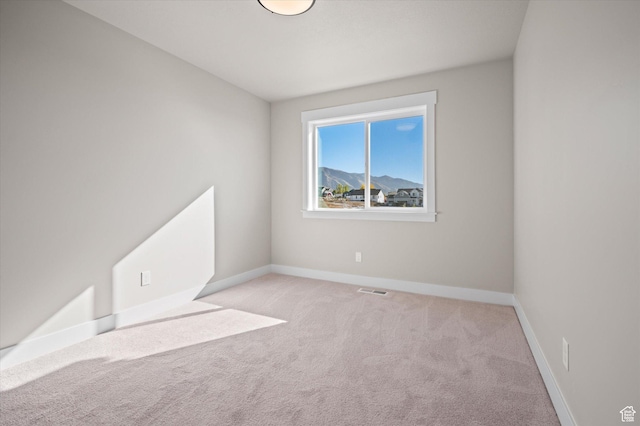 831 E 490 N Unit 143, Hyde Park, UT 84318 - spare room featuring light carpet and a mountain view