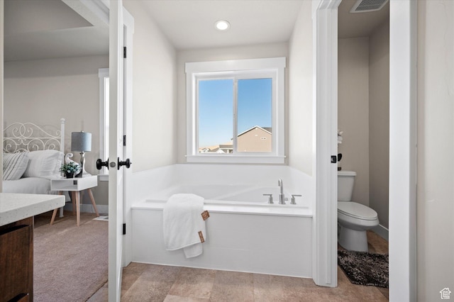 831 E 490 N Unit 143, Hyde Park, UT 84318 - bathroom featuring a tub to relax in and toilet