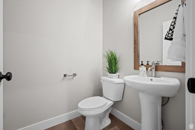 831 E 490 N Unit 143, Hyde Park, UT 84318 - bathroom featuring hardwood / wood-style flooring, sink, and toilet