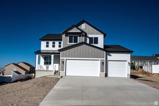 831 E 490 N Unit 143, Hyde Park, UT 84318 - view of front of home featuring a garage and a porch