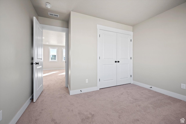 831 E 490 N Unit 143, Hyde Park, UT 84318 - unfurnished bedroom featuring light colored carpet and a closet