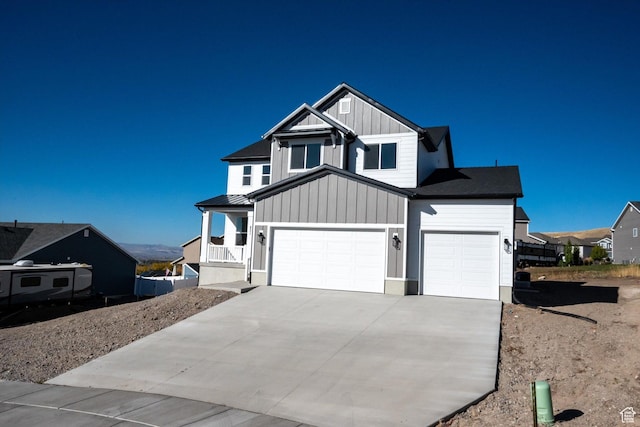 831 E 490 N Unit 143, Hyde Park, UT 84318 - view of front of house featuring a porch and a garage