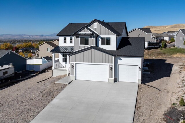 831 E 490 N Unit 143, Hyde Park, UT 84318 - view of front facade featuring a mountain view and a garage