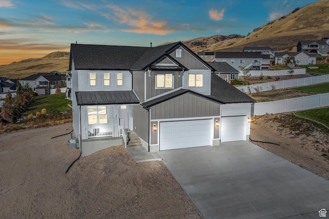 831 E 490 N Unit 143, Hyde Park, UT 84318 - view of front facade with a garage and a mountain view