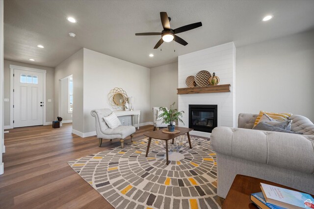 831 E 490 N Unit 143, Hyde Park, UT 84318 - living room featuring hardwood / wood-style floors, a large fireplace, and ceiling fan