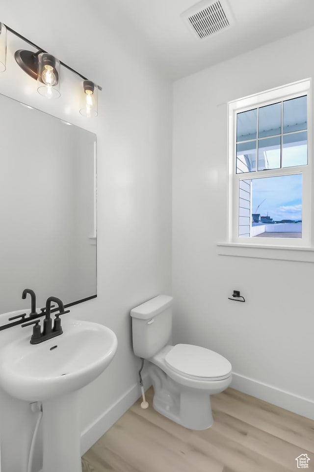3463 W 3175 N Unit 362, Plain City, UT 84404 - bathroom featuring sink, toilet, and hardwood / wood-style floors
