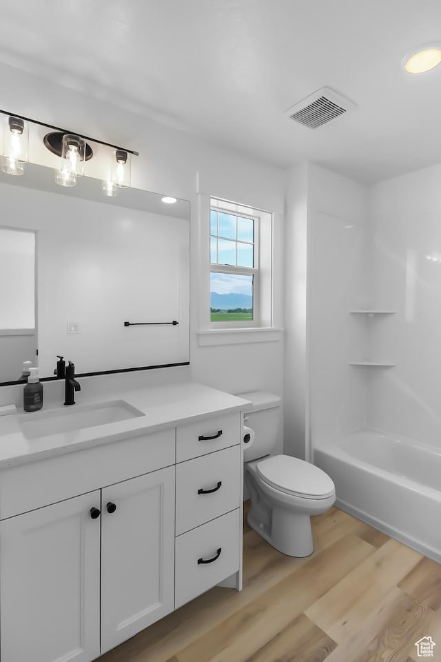 3463 W 3175 N Unit 362, Plain City, UT 84404 - full bathroom featuring vanity, bathtub / shower combination, hardwood / wood-style floors, and toilet