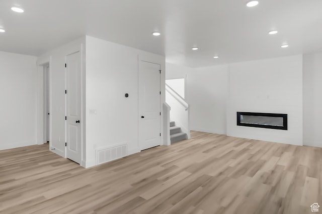 3463 W 3175 N Unit 362, Plain City, UT 84404 - unfurnished living room featuring light hardwood / wood-style floors