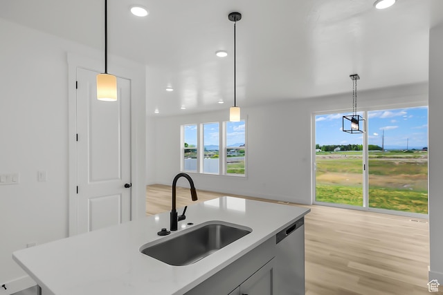 3463 W 3175 N Unit 362, Plain City, UT 84404 - kitchen with an island with sink, dishwasher, sink, and hanging light fixtures