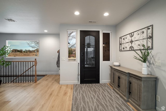 entryway featuring light wood-style floors, recessed lighting, and baseboards