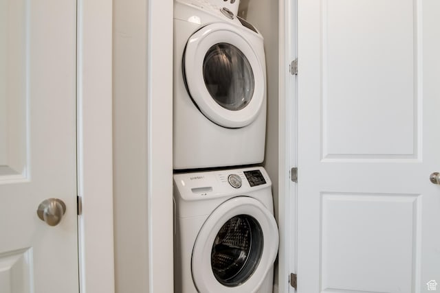 laundry area featuring stacked washer and dryer