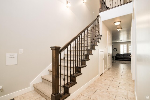 staircase with tile patterned flooring