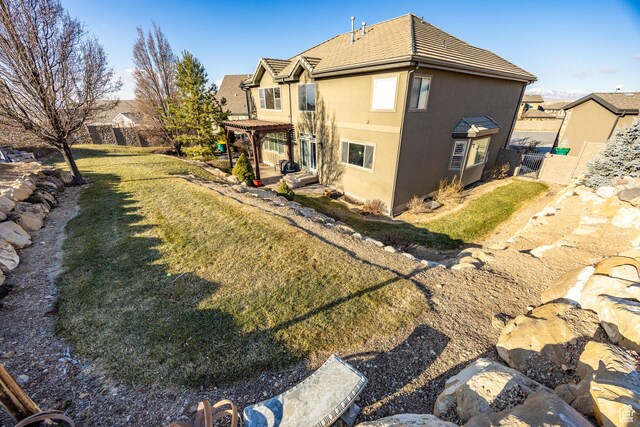 1903 W Wild Wood Ct N, Lehi, UT 84043 - back of property with a lawn and a pergola