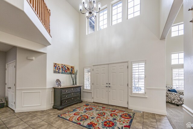 1903 W Wild Wood Ct N, Lehi, UT 84043 - entrance foyer with tile patterned floors and a chandelier