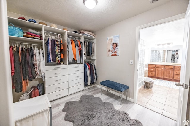 1903 W Wild Wood Ct N, Lehi, UT 84043 - walk in closet with light hardwood / wood-style flooring