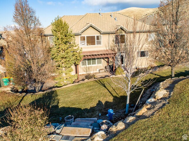 1903 W Wild Wood Ct N, Lehi, UT 84043 - back of house featuring a pergola, a lawn, and a mountain view