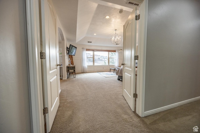 1903 W Wild Wood Ct N, Lehi, UT 84043 - corridor featuring a raised ceiling, carpet flooring, and a notable chandelier