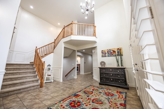 1903 W Wild Wood Ct N, Lehi, UT 84043 - tiled foyer entrance featuring a towering ceiling and a chandelier