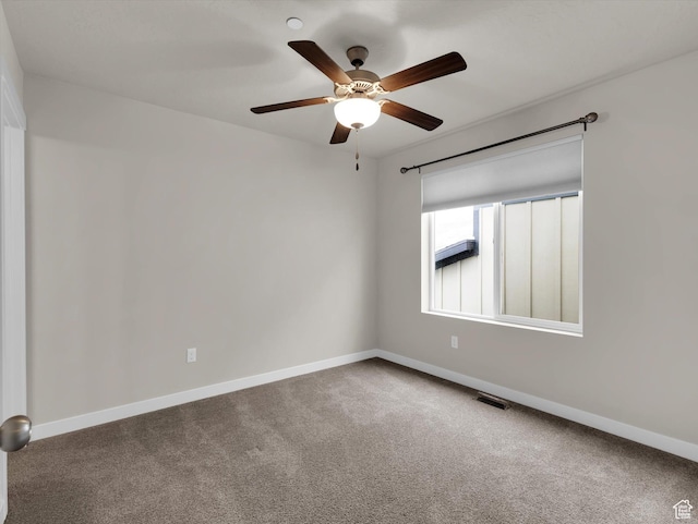 empty room featuring ceiling fan and carpet flooring