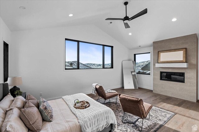 11432 N Fox Hollow Ct Unit 121, Hideout, UT 84036 - bedroom featuring lofted ceiling, recessed lighting, baseboards, a fireplace, and wood finished floors