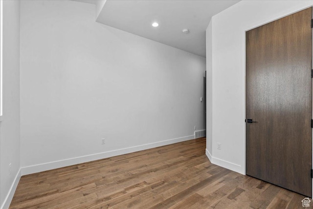 11432 N Fox Hollow Ct Unit 121, Hideout, UT 84036 - unfurnished bedroom with baseboards, visible vents, wood finished floors, and recessed lighting