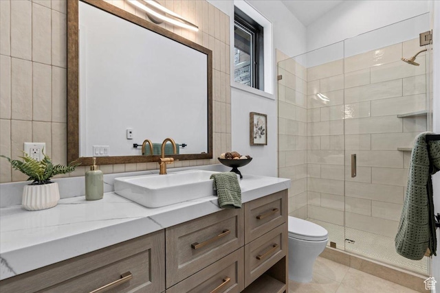 11432 N Fox Hollow Ct Unit 121, Hideout, UT 84036 - bathroom with tile patterned flooring, vanity, tile walls, toilet, and a shower stall