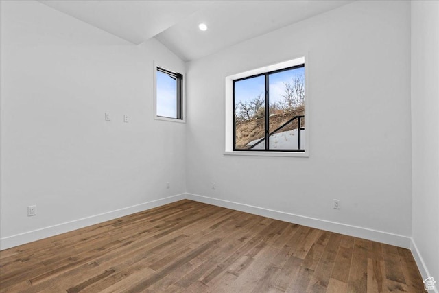 11432 N Fox Hollow Ct Unit 121, Hideout, UT 84036 - unfurnished room with recessed lighting, baseboards, lofted ceiling, and wood finished floors
