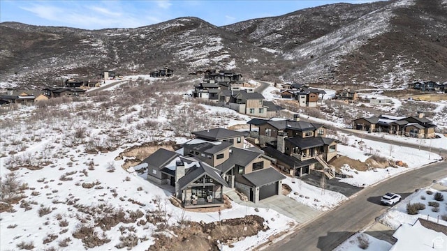 11432 N Fox Hollow Ct Unit 121, Hideout, UT 84036 - snowy aerial view featuring a mountain view and a residential view