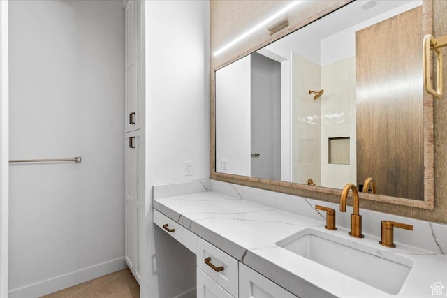 11432 N Fox Hollow Ct Unit 121, Hideout, UT 84036 - bathroom with vanity, baseboards, and a tile shower