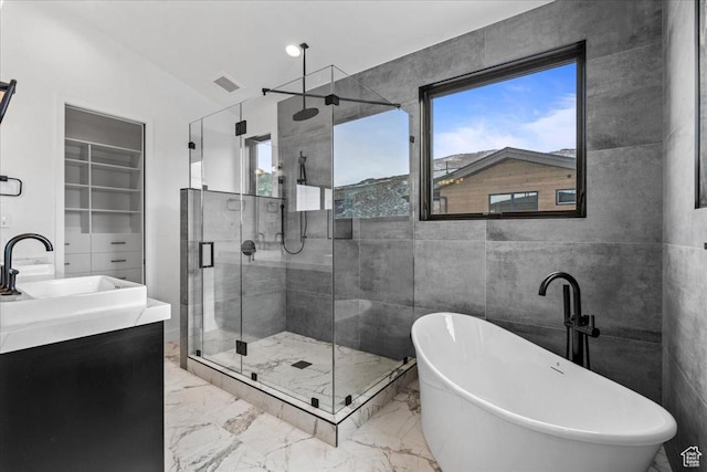 11432 N Fox Hollow Ct Unit 121, Hideout, UT 84036 - full bath with a freestanding tub, marble finish floor, visible vents, and a stall shower