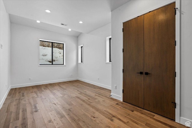 11432 N Fox Hollow Ct Unit 121, Hideout, UT 84036 - unfurnished bedroom featuring baseboards, visible vents, recessed lighting, and light wood-type flooring