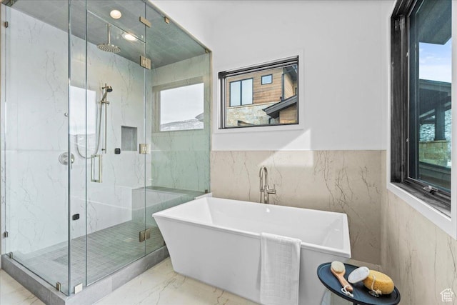 11432 N Fox Hollow Ct Unit 121, Hideout, UT 84036 - full bath featuring marble finish floor, a freestanding bath, tile walls, and a marble finish shower