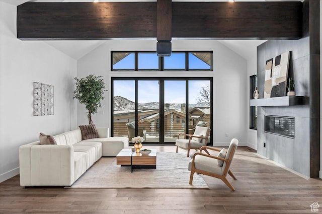 11432 N Fox Hollow Ct Unit 121, Hideout, UT 84036 - living area featuring baseboards, a fireplace, wood finished floors, and lofted ceiling with beams