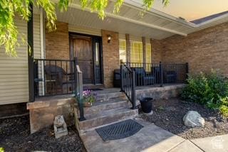 1381 W Quail Covey Cir W, Riverton, UT 84065 - property entrance featuring a porch and brick siding