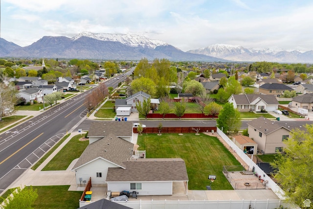 birds eye view of property with a residential view and a mountain view
