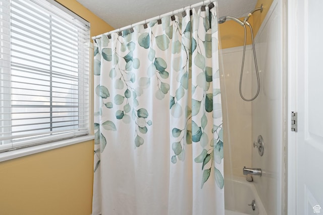 bathroom with shower / tub combo