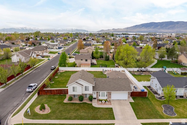 birds eye view of property with a mountain view and a residential view